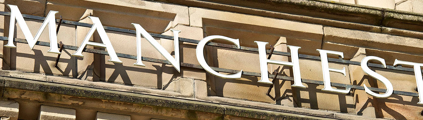 Close-up of University of Manchester lettering on Whitworth Hall exterior