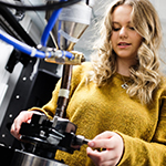 A female researcher operating X-ray machinery